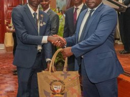 Delegate Receiving a Reward from The Chief Guest, VCDF Lieutenant General John Omenda